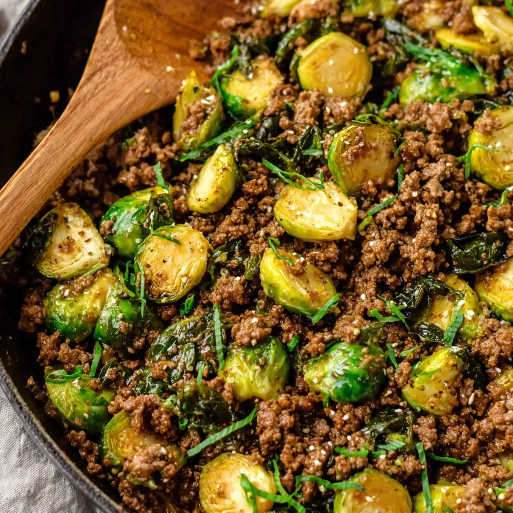 A bowl of ground beef and brussels sprouts.