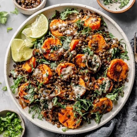 A bowl of sweet potato salad with lentils.